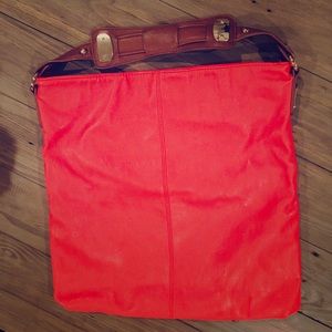 Large tangerine colored Express purse